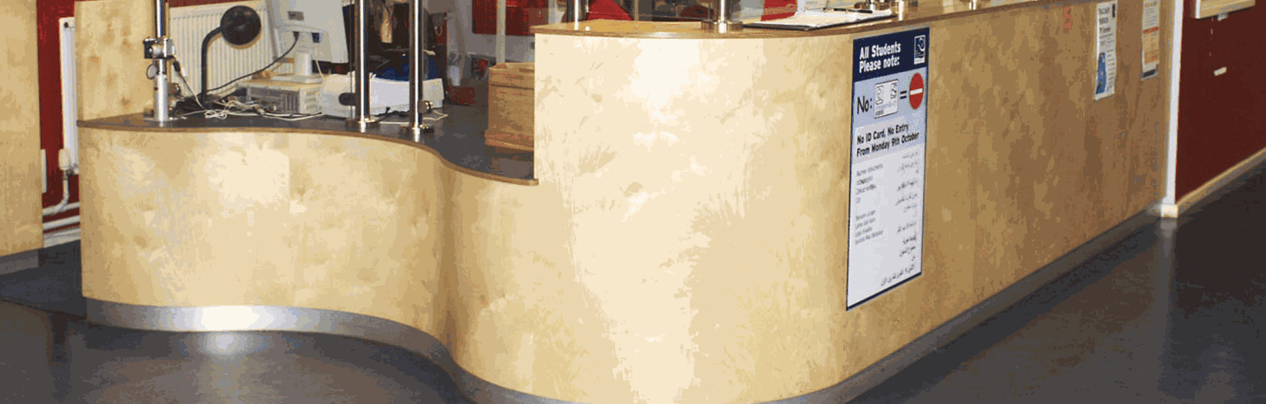 Bespoke curved timber reception desk made for a commercial interior