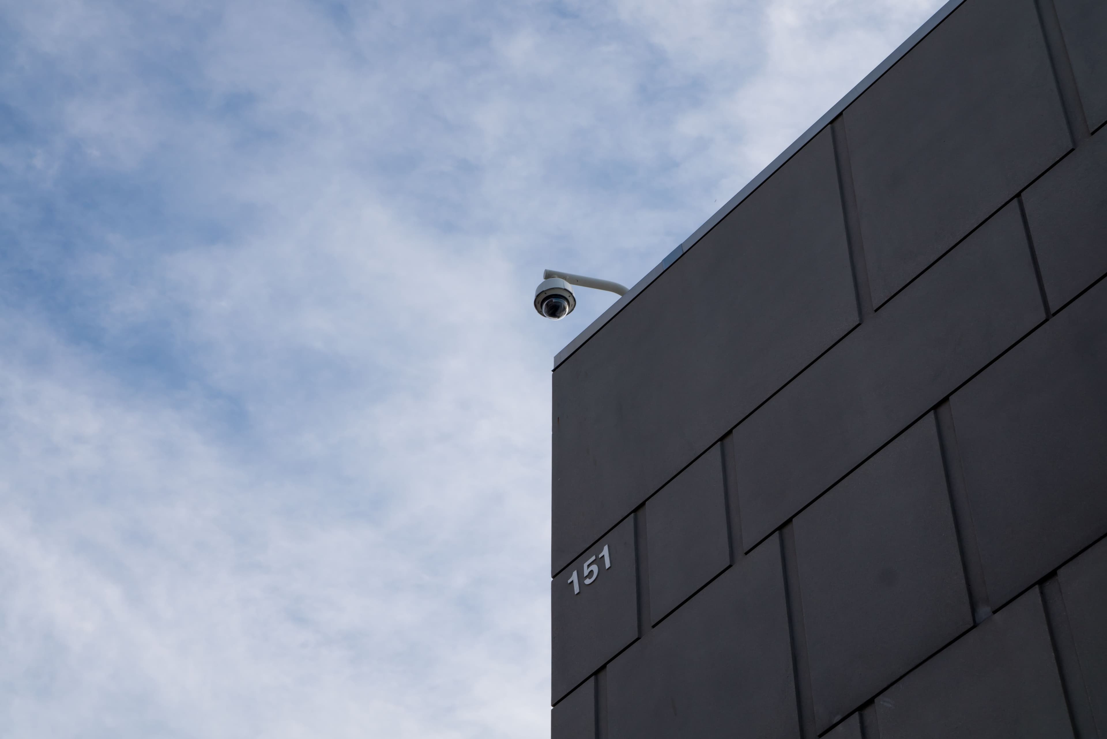 Premium commercial office interior with integrated security, access control, and CCTV surveillance systems