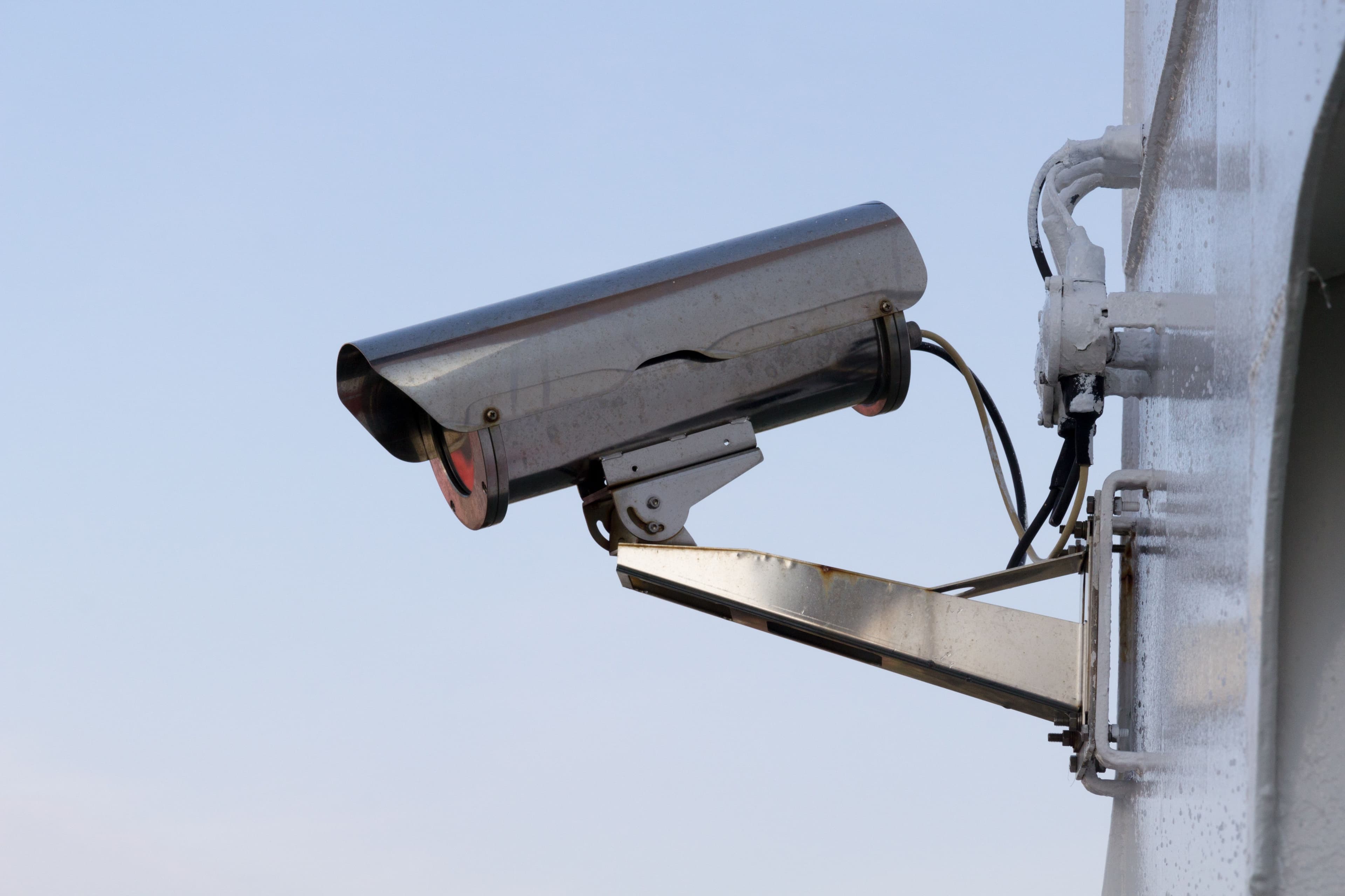 Modern commercial workspace with active security monitoring and alarm systems